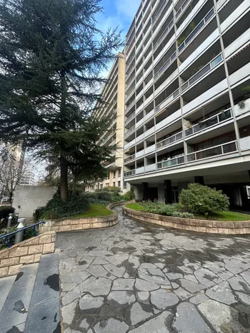 Courtyard garden with stone path and modern building